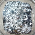Which side should you place foil on baking trays in the oven?