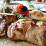 Soft and juicy pork kebab with onion and vinegar