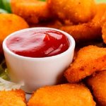 Nuggets are served with tomato, sweet and sour or cheese sauce