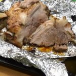 Tasty and juicy pork knuckle baked in the oven in foil